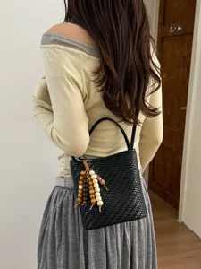 Korean style black woven bucket bag with decorative wooden bead charm for women