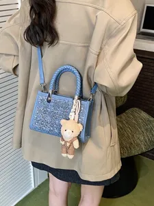 Stylish denim blue woven small tote bag featuring sequins and a cute bear keychain