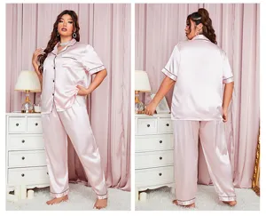 Elegant plus size pink satin pajama set with short sleeve top and matching long pants