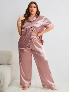 Detailed view of women's plus-size satin pajama set in dusty rose color