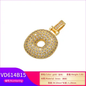Detailed view of gold-tone hip-hop 'O' pendant micro-paved with sparkling zircons.