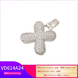 Detailed view of hip-hop cross pendant in rhodium-plated brass with micro-paved zircons