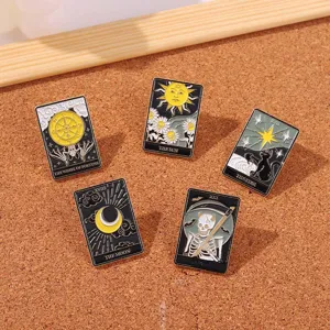 Collection of five vintage tarot card enamel pins displayed on a textured cork background.