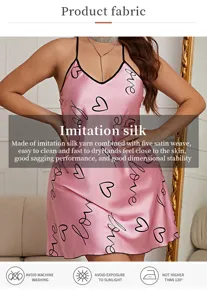 Detailed view of pink satin nightdress fabric with heart and love prints.