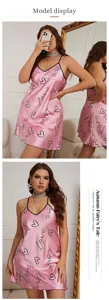 Detailed view of women's pink satin nightgown with heart and love script prints