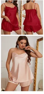 Detailed view of women's elegant satin pajama set with silky camisole and matching shorts.
