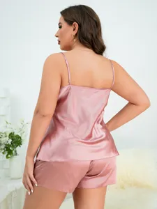 Back view of a pink satin camisole and shorts pajama set for women, breathable summer loungewear.