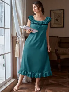 Detailed view of teal satin homewear with elegant ruffle hem and bow decoration