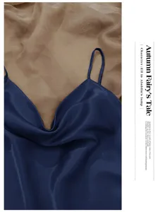 Macro detail of dark blue ice silk camisole showing smooth satin texture and elegant drape