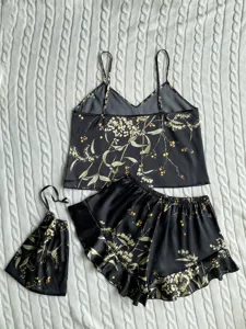 Elegant black floral print faux silk pajama set including camisole shorts and pouch