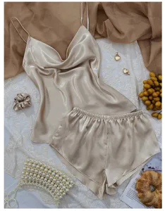 Elegant champagne satin camisole and shorts sleepwear set with soft silk texture