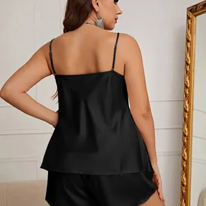 Elegant black ice silk pajama set featuring a silky camisole and matching shorts.