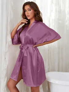 Elegant purple silk satin bathrobe for women shown in a detailed lifestyle bathroom setting