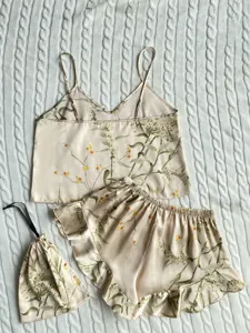 Floral print satin pajama set including camisole top, ruffled shorts and matching bag