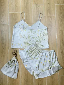 Floral print satin camisole pajama set with matching ruffled shorts and storage bag