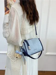 Stylish denim blue commuter crossbody bag with cute teddy charm for women