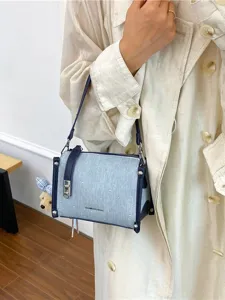 Stylish Korean denim blue crossbody bag featuring silver studs and chic commuter style