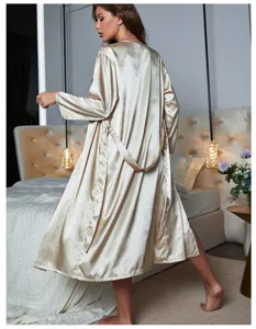 Back detail of elegant champagne satin long sleeve robe with tie waist in bedroom