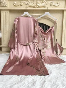Detailed view of pink floral satin pajama set featuring a robe and camisole dress