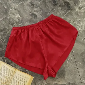 Elegant red satin loungewear sleep shorts for women on a stylish marble background