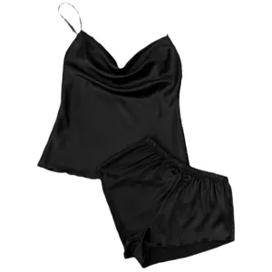 Elegant black silk satin pajama set featuring a camisole top and matching shorts for women