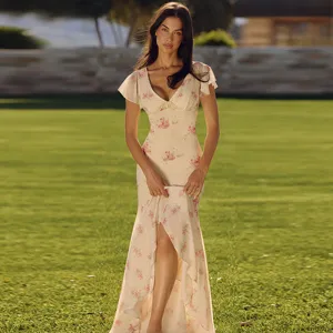 Detailed shot of the floral print V-neck midi dress on model outdoors, elegant and slim-fit style.