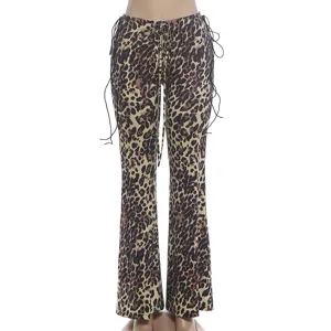 Close up detail of womens leopard print flare pants featuring stylish side drawstrings.