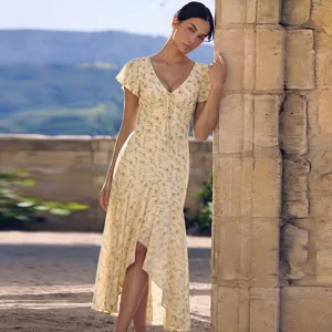 Detail shot of the elegant French style floral print V-neck midi dress with short flutter sleeves.