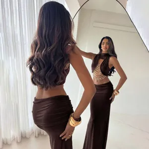 Brown sleeveless mock neck pearl chain crop top and low waist maxi skirt fashion outfit
