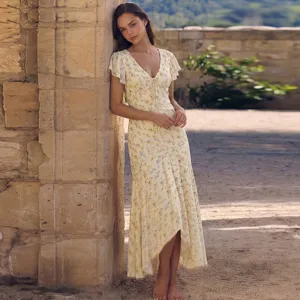 Detailed view of the elegant V-neck floral midi dress with tie front and short flutter sleeves.