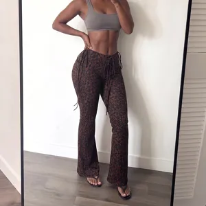 Stylish women's low-waist leopard print micro-flared trousers, sexy slim fit casual pants.