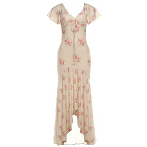 Close-up detail showing the elegant floral print, feminine V-neck, and ruffled short sleeves.