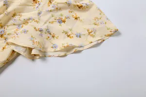 Floral print dress detail, elegant French style V-neck women's long dress fabric.