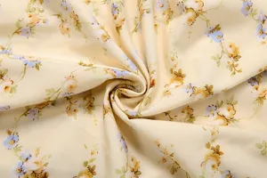 French vintage floral print fabric detail, elegant light yellow material for dress.