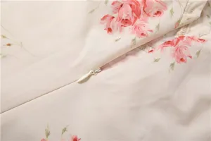 Detail view of women's floral print dress fabric and zipper, elegant French style design.