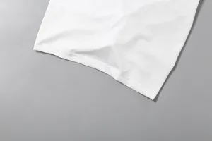 Close-up detail of women basic summer white top hem, clean stitching texture design.