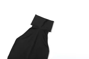 Close-up detail view of a black high neck sleeveless slim fit tank top with a chic cutout design.