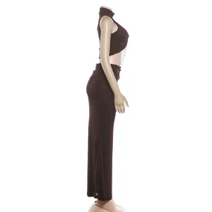 Side view of brown women's slim mock neck sleeveless crop top and low-waist maxi skirt set.