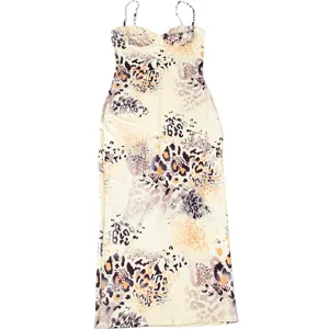 Detailed view of the stylish sleeveless spaghetti strap bodycon dress with abstract print.
