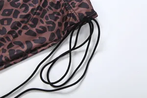 Leopard print pants detail shot focusing on the stylish drawstring design and soft fabric.