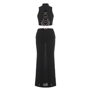 Women's summer slim mock neck sleeveless crop top and slit skirt two-piece set with pearls.