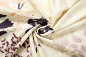 Detailed shot of trendy abstract print fabric for women dress, showing smooth texture.
