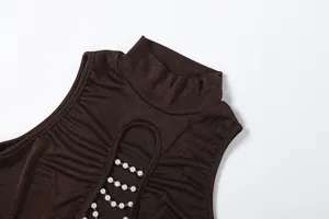 Brown sleeveless mock neck top detail showcasing ruched fabric and decorative pearl chain cutout.