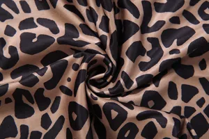 Detailed shot of trendy leopard print fabric showing soft texture and clear pattern design.