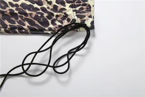 Leopard print flare pants detail showcasing soft fabric and adjustable black drawstring waist.