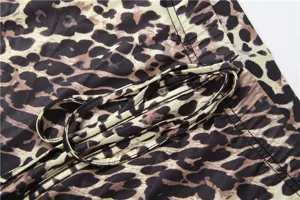Leopard print flare pants detail showcasing soft fabric and adjustable drawstring waist.
