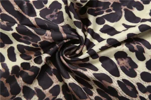 Detailed view of the stylish leopard print fabric texture showing clear pattern and soft material.