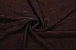 Brown rib knit fabric texture detail, soft and stretchy material close-up