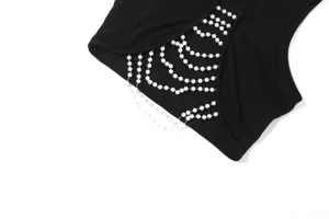 Black sleeveless cutout crop top detail with elegant multi-layer faux pearl chain embellishment.