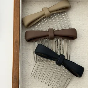 Detailed view of matte bow hair combs in khaki, brown, and black colors.